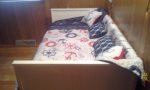 Main level bedroom has a day bed with trundle